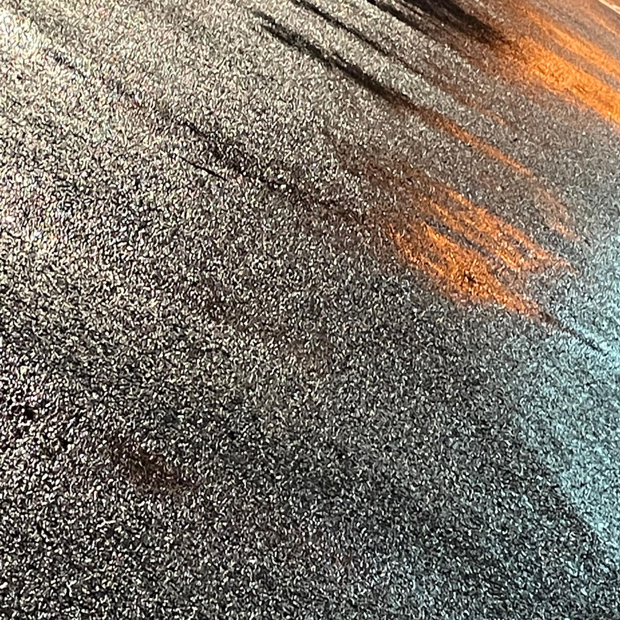 Sidewalk pavement sections with horizontal and vertical lines showing texture.